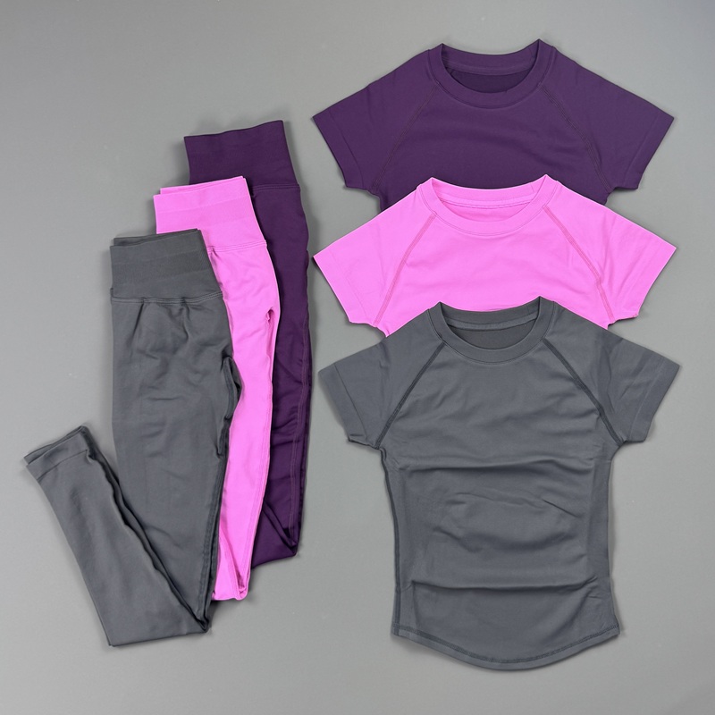 Pilates Yoga Legging - ชุดออกกำลังกาย 2 ชิ้นสำหรับผู้หญิง เสื้อกีฬาแขนสั้นแบบแร็กแลน กางเกงเลกกิ้งเอวสูงไร้ตะเข็บ ผ้ายกกระชับสะโพก